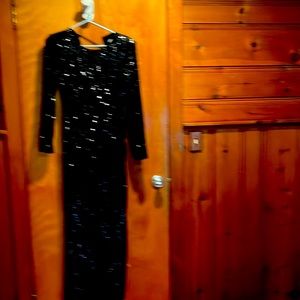 Very formal long black gown front has an opening in front